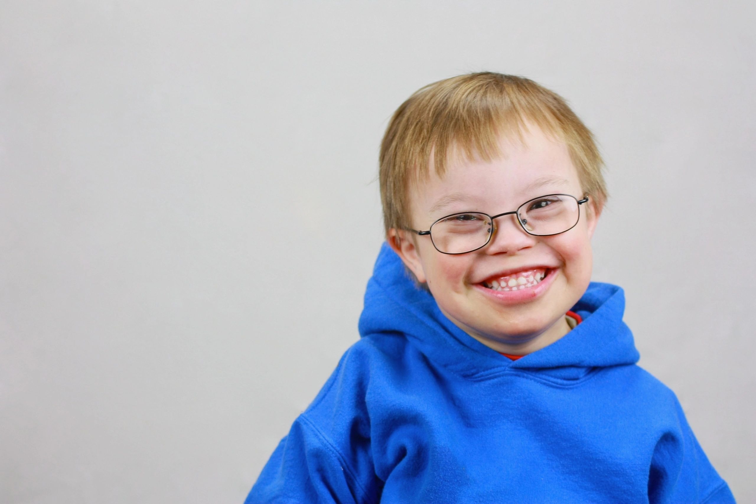 Young child wearing glasses smiling